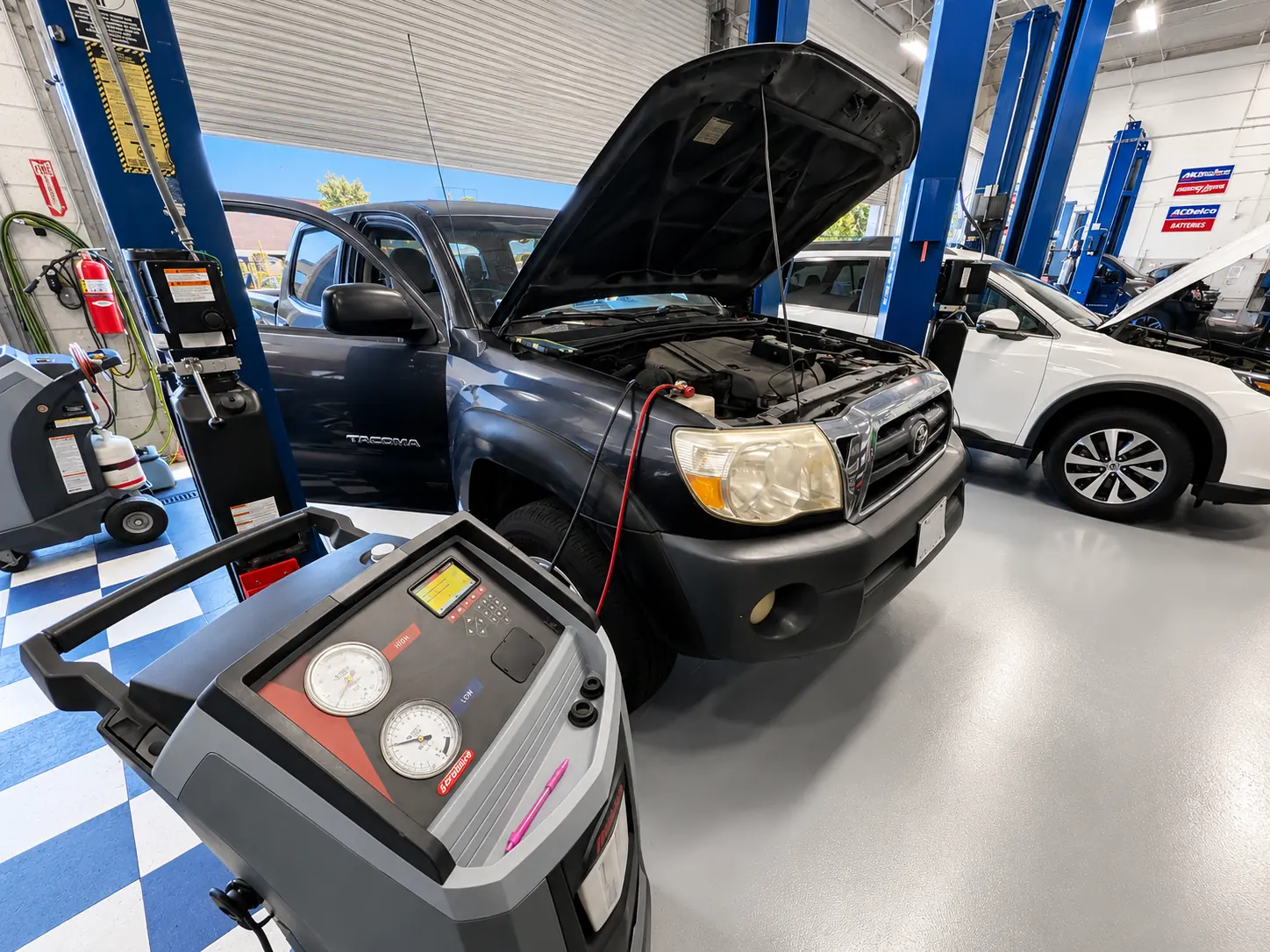 A/C recovery machine connected to a truck at HB Auto & AC