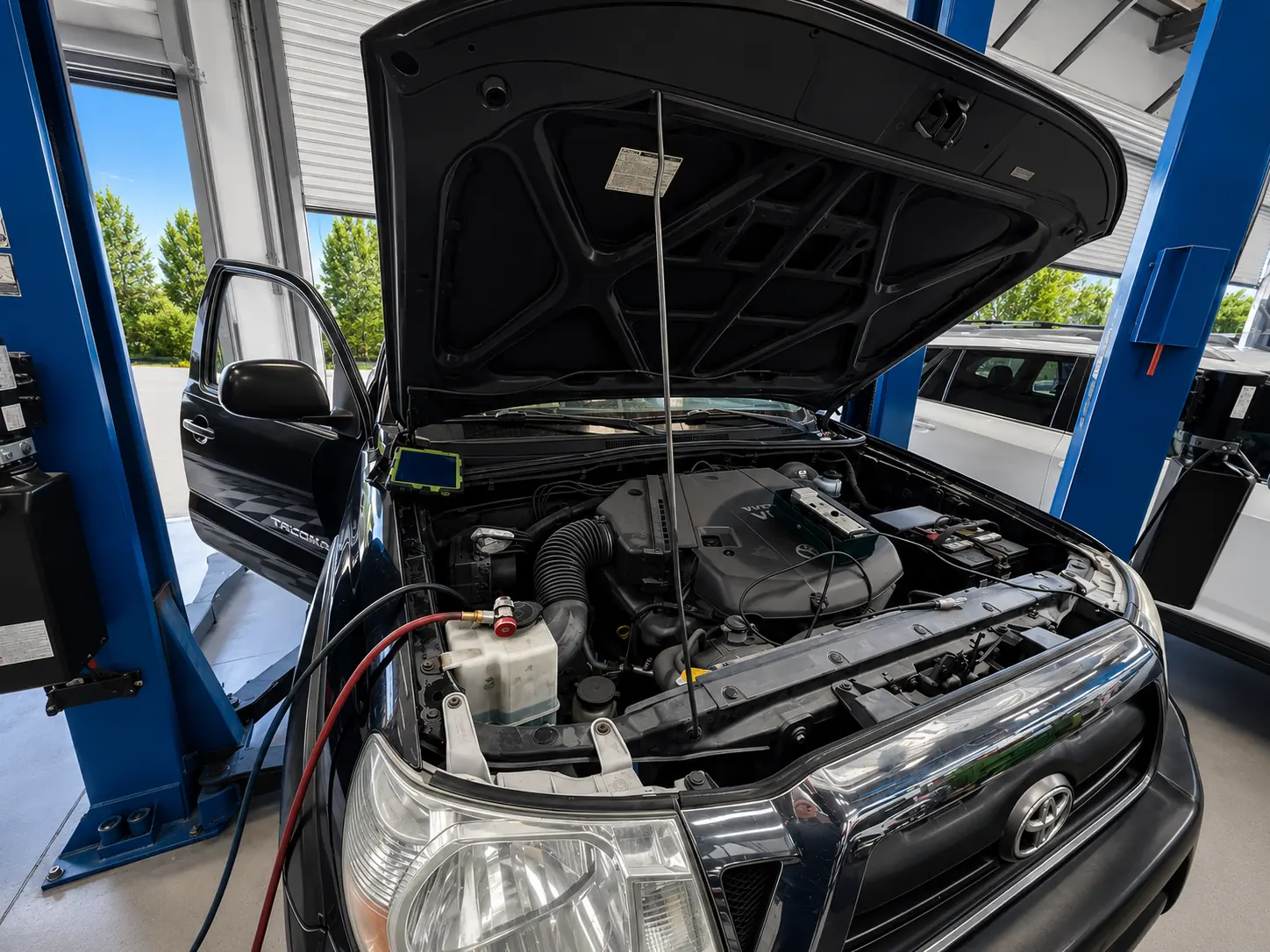 Truck with hood open for engine service at HB Auto & AC