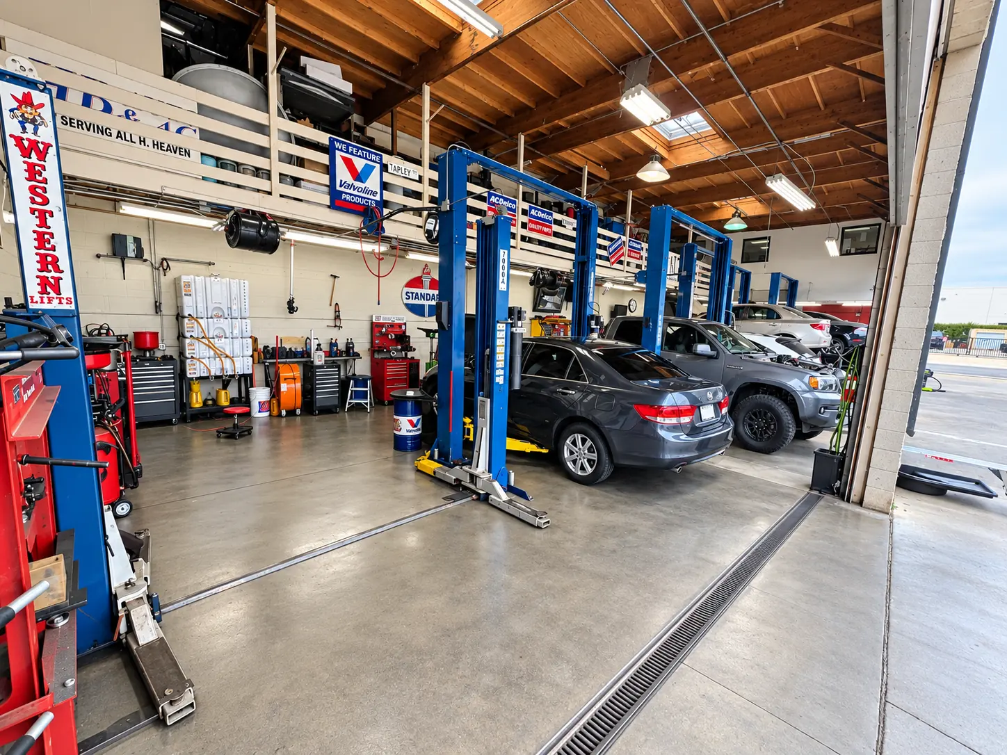 Service bays and lifts inside HB Auto & AC