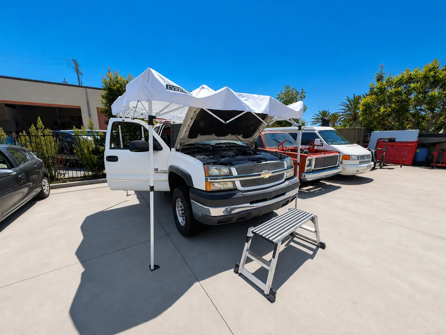 Work truck parked at HB Auto & AC in Huntington Beach